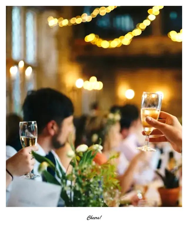Single instant-photo frame of friends raising champagne glasses with the caption “Cheers!”